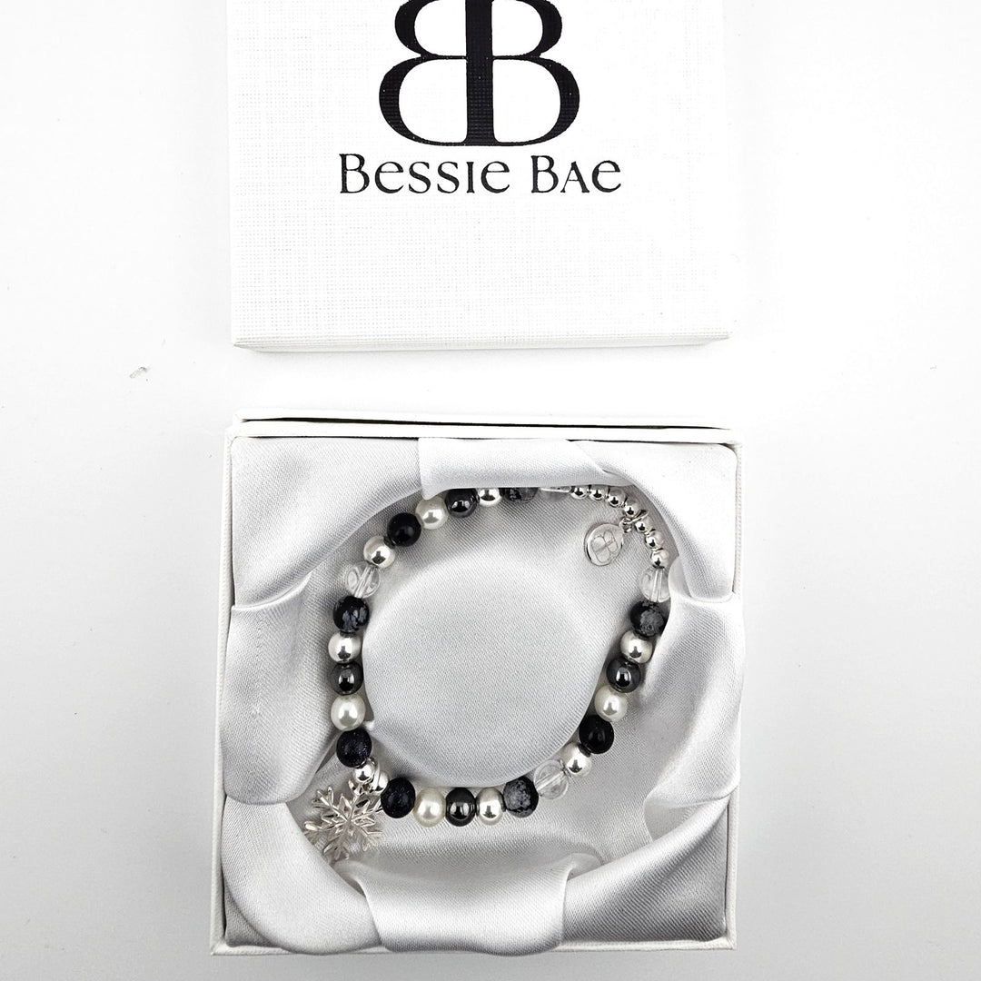 Handmade bracelet with snowflake obsidian, rock crystal, and sterling silver.