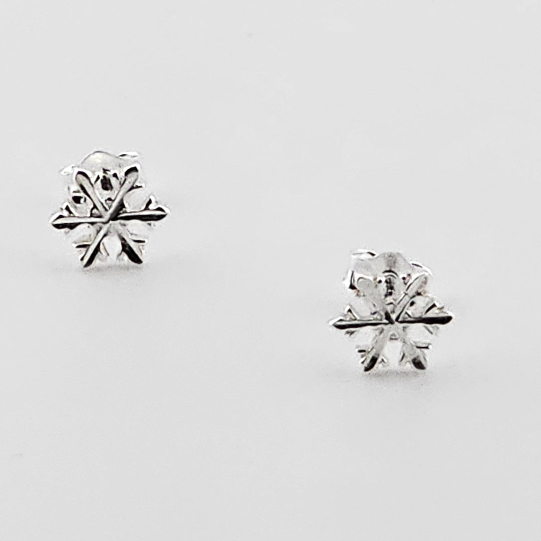 Dainty winter snowflake earrings in sterling silver.