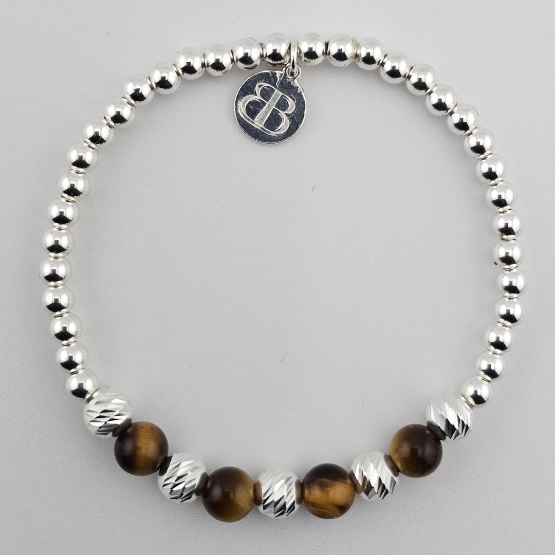 Sterling silver and tiger’s eye gemstone bracelet.