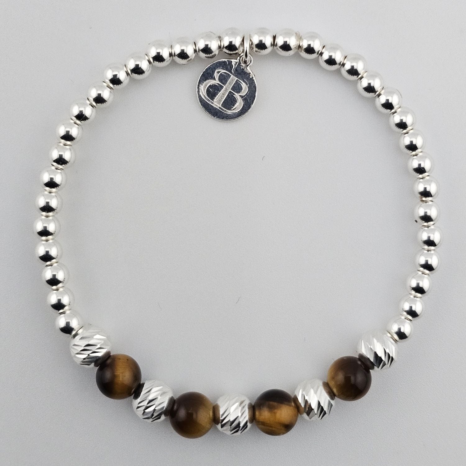Sterling silver and tiger’s eye gemstone bracelet.