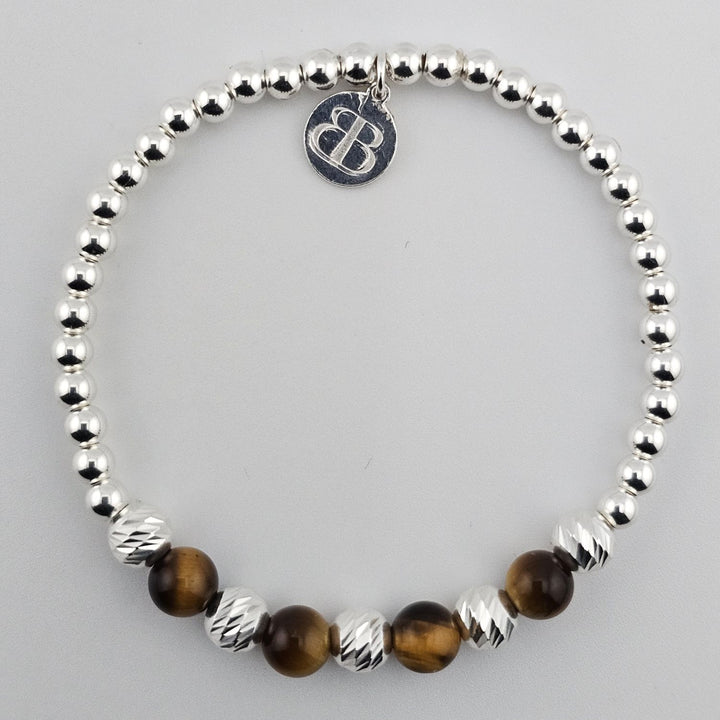 Sterling silver and tiger’s eye gemstone bracelet.