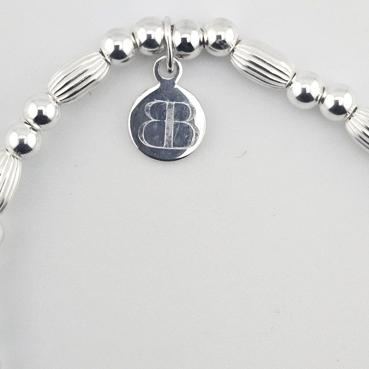 Tree of Life charm bracelet made from sterling silver beads.