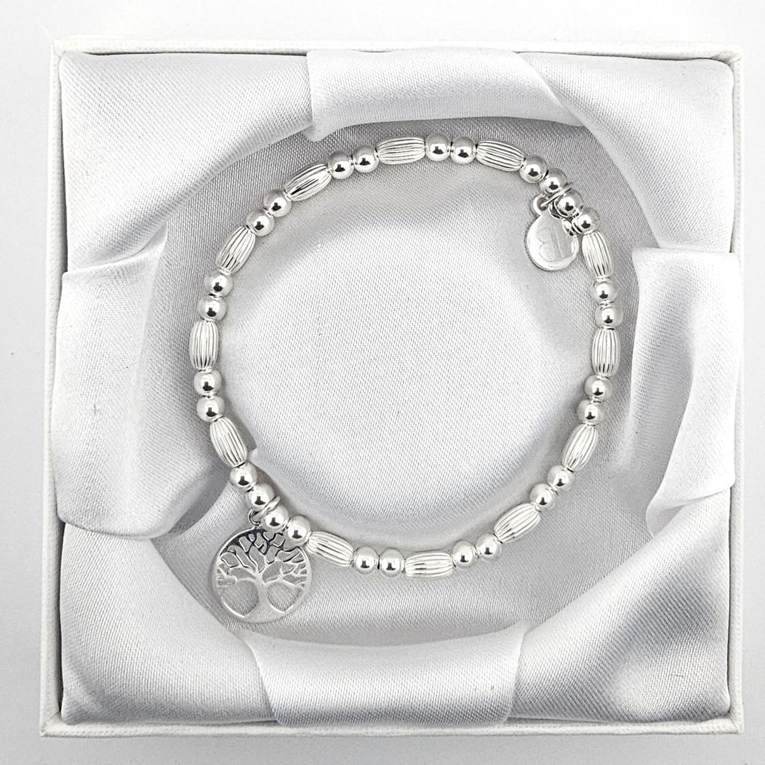 All-silver beaded bracelet featuring Tree of Life charm.