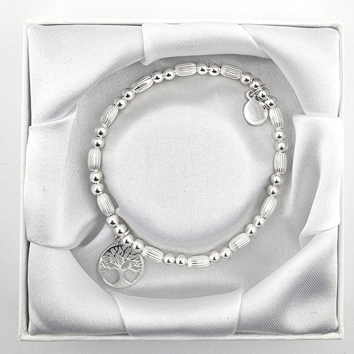 All-silver beaded bracelet featuring Tree of Life charm.