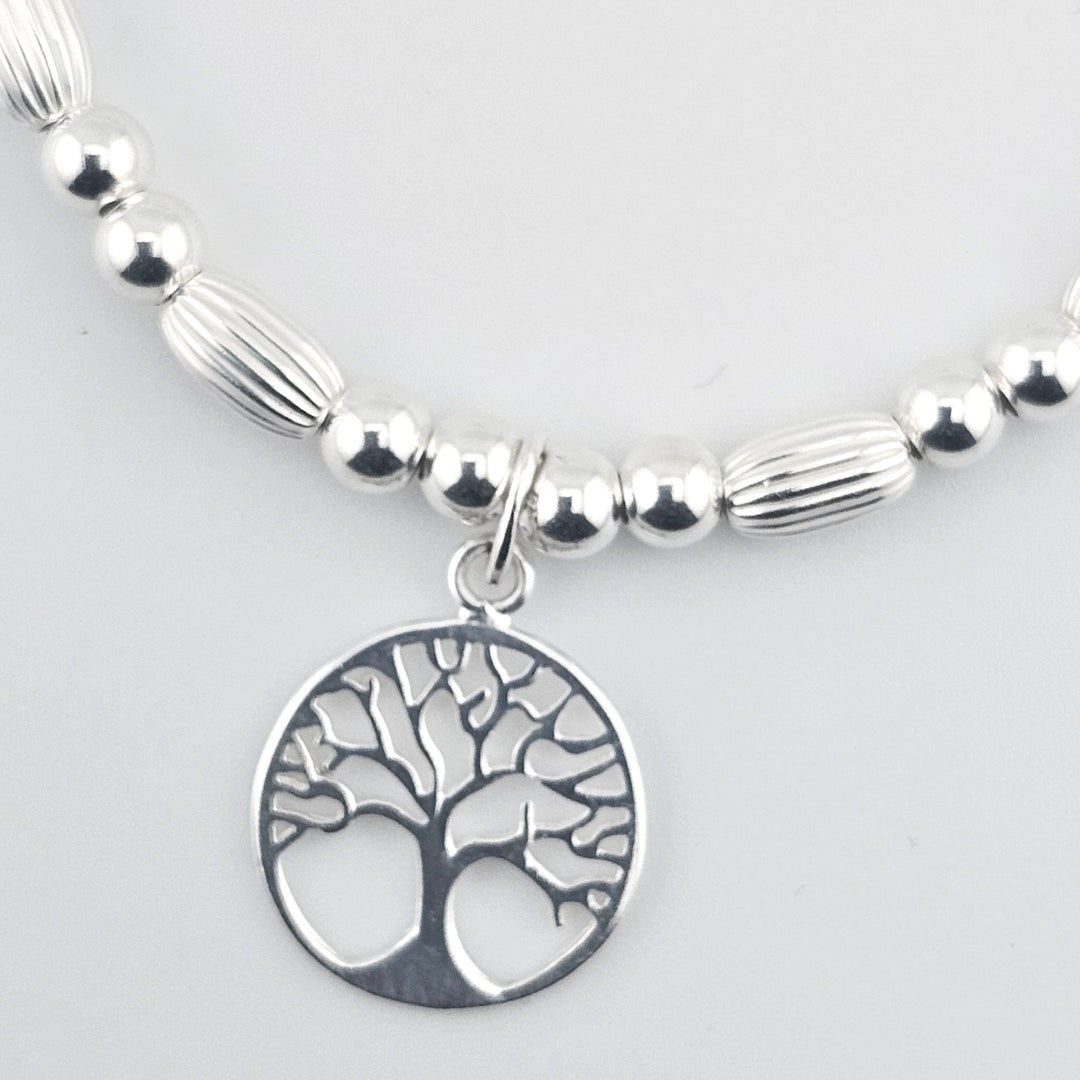 Elegant silver bracelet symbolising growth and harmony.