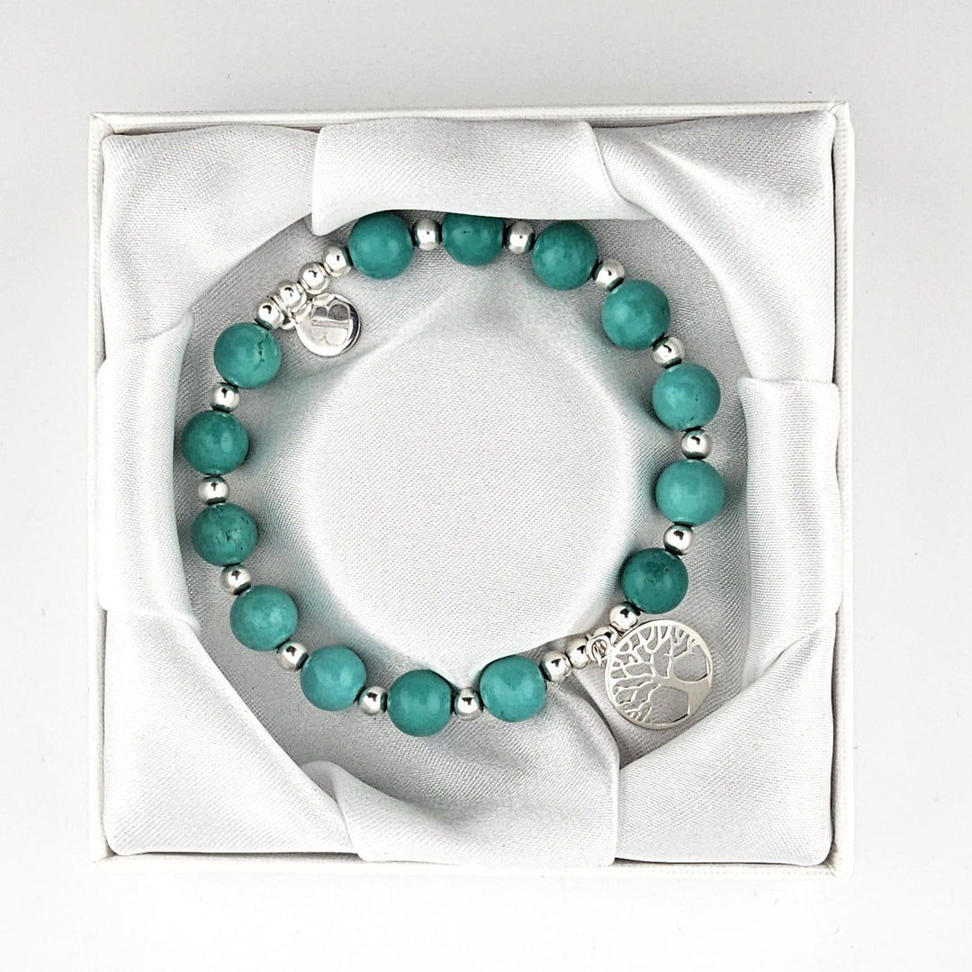 Handmade turquoise gemstone bracelet with Tree of Life charm.
