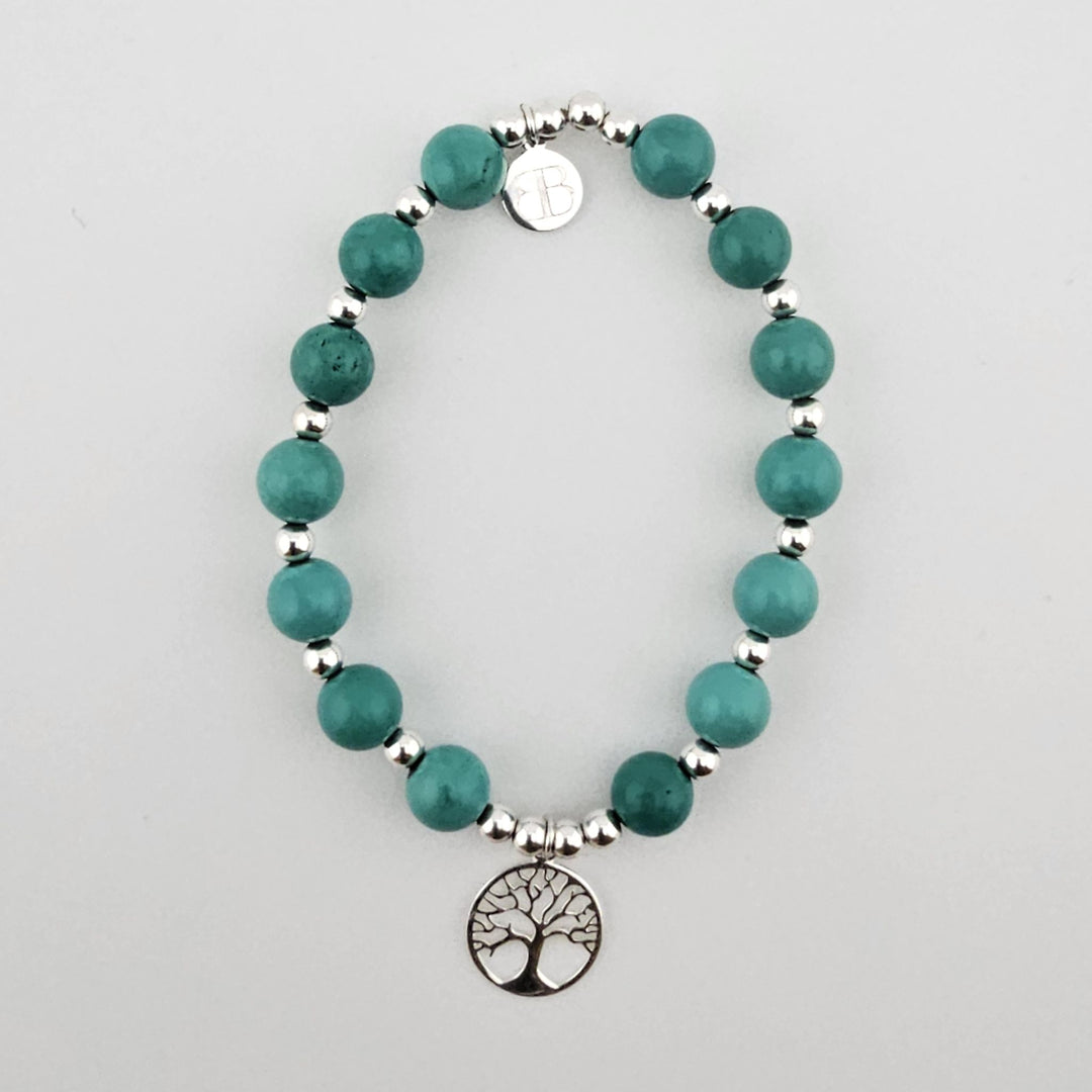 Sterling silver Tree of Life bracelet with turquoise beads.