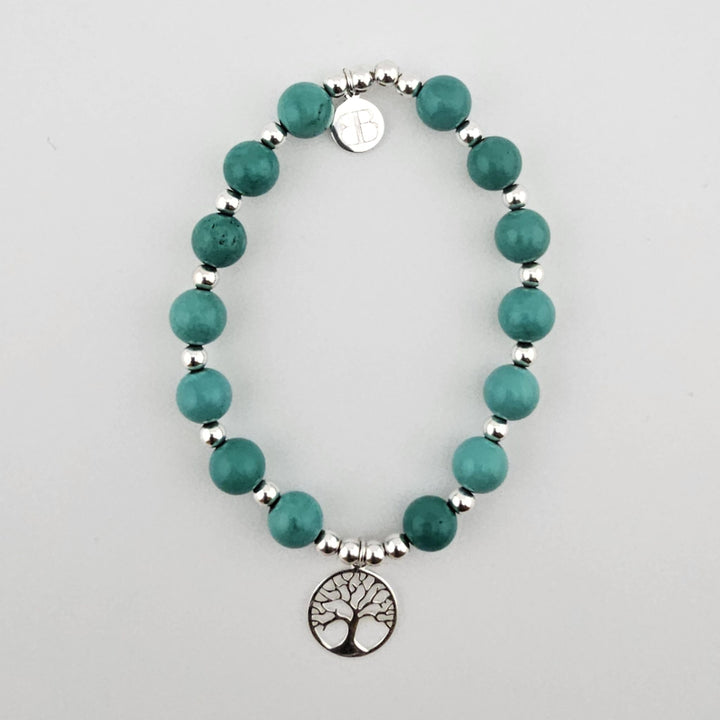 Sterling silver Tree of Life bracelet with turquoise beads.