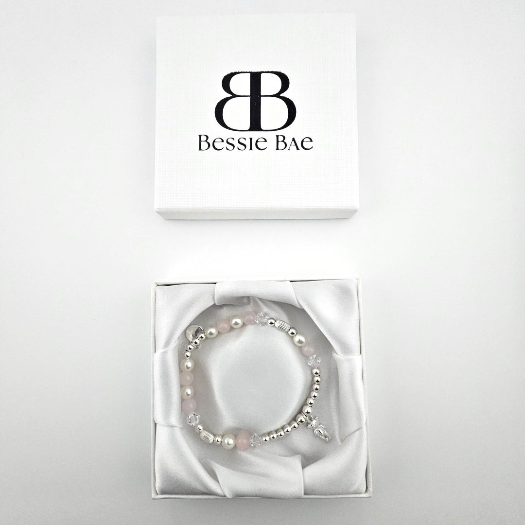 Delicate teddy bear charm bracelet with Rose Quartz and crystal beads in Bessie Bae gift box.